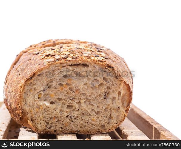 Cut Whole Grain Bread on Wooden Cutting Board over white background