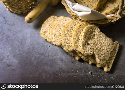 Cut with slices and whole grain bread Homemade fresh bread on the floor
