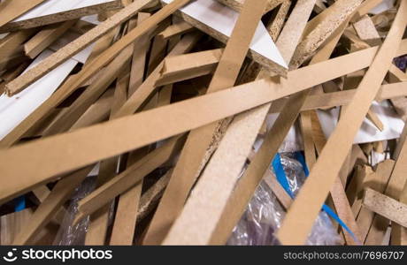 Cut wood pieces remaining from carpenter handcraft at manufacturing company, ready to recycle and reuse process