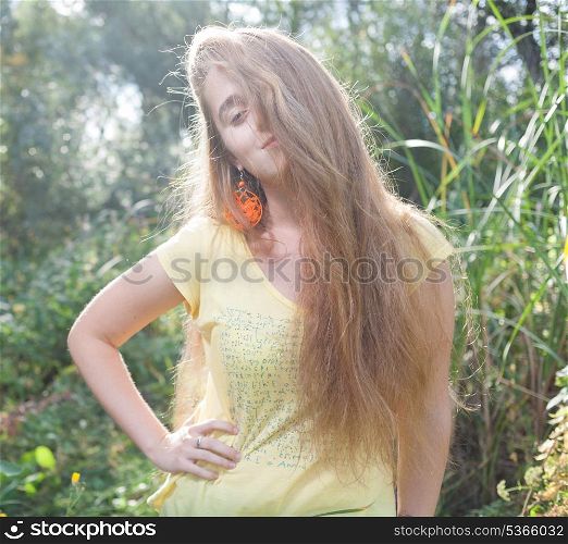 Cute 20s blonde outdoors. Colorized image