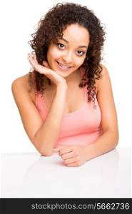 Cute afro girl posing on a table over white background