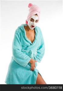 cute and nice girl with face cream mask posing and making face