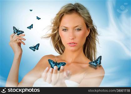 cute and sensual blond girl with blue flying butterfly all around her