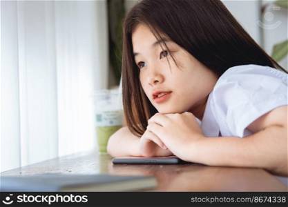 Cute Asian university students looking windows lovely teen missing or waiting someone love emotion