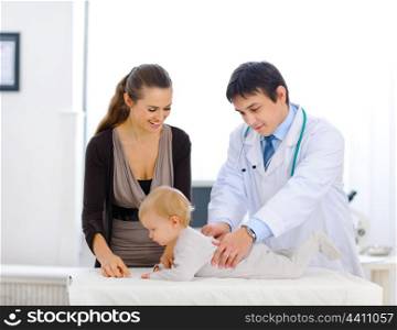 Cute baby being checked by a pediatric doctor&#xA;