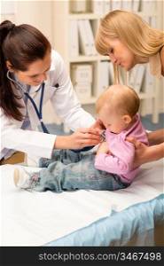 Cute baby being examine by pediatrician with stethoscope