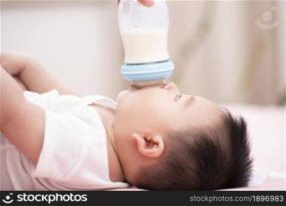 Cute baby drinking milk