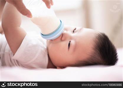Cute baby drinking milk