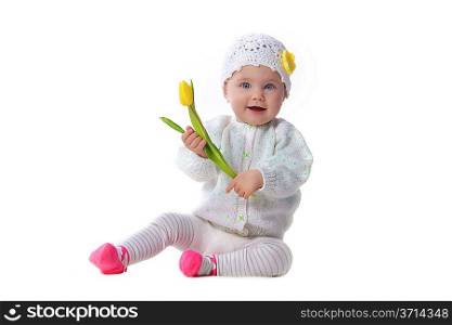 Cute baby girl holding yellow tulip