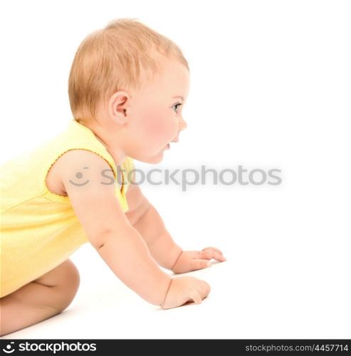 Cute baby girl wearing yellow dress isolated on white background, crawling in the studio, healthy lifestyle, happy childhood concept