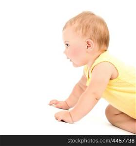 Cute baby girl wearing yellow dress isolated on white background, crawling in the studio, healthy lifestyle, happy childhood concept&#xA;