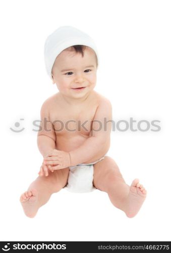 Cute baby in diaper sitting isolated on a white background