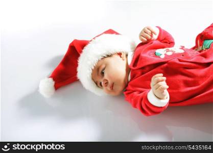 Cute baby in santa wear on white