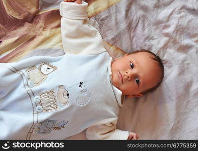 cute baby on parents bed, portrait