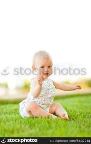 Cute baby playing on grass