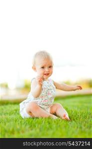 Cute baby playing on grass
