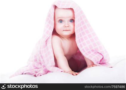 cute baby siting under towel