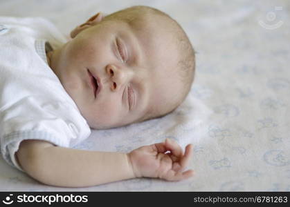 Cute baby sleeping on its back. Face of a ute baby sleeping on its back and dreaming