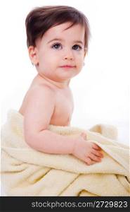Cute baby wrapped in bath towel in white isolated background
