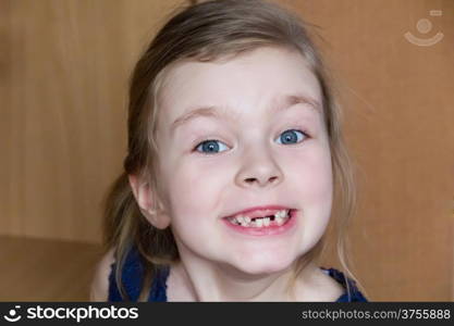 Cute beautiful toothless girl makes faces