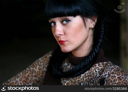 cute black haired girl against dark background