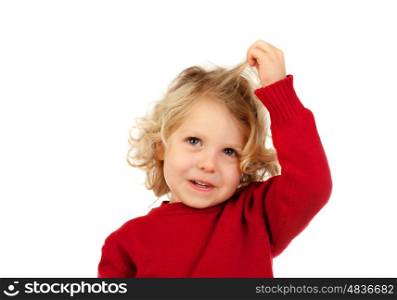 Cute blond child touching his long hair isolated on a white background