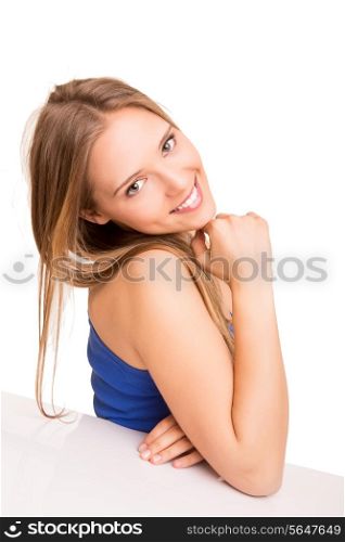 Cute blond girl posing over white background