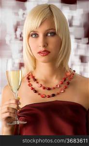 cute blond with cup of champagne and a red necklace