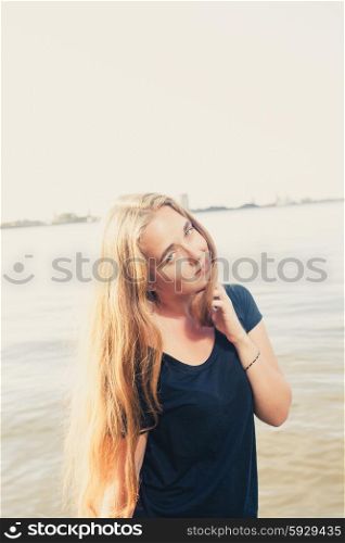 Cute blonde face and shoulders image toned colors