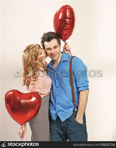Cute blonde girl kissing her valentine&rsquo;s boyfriend