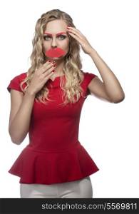 cute blonde girl posing like a doll in funny portrait, wearing fake mouth and eyebrows and red dress. Long wavy hair. Photo booth style