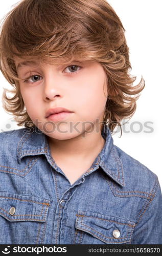 Cute blonde kid posing over white background