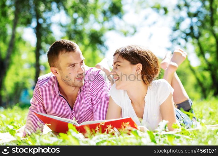 Cute boy and young woman in summer park. Weekend in park