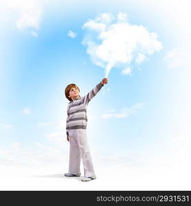 Cute boy catching clouds