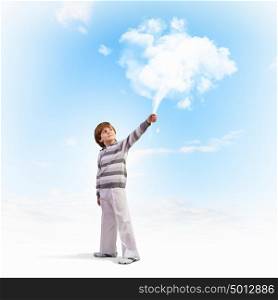 Cute boy dreaming. Image of little cute boy catching clouds in sky