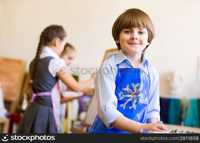 Cute boy painting