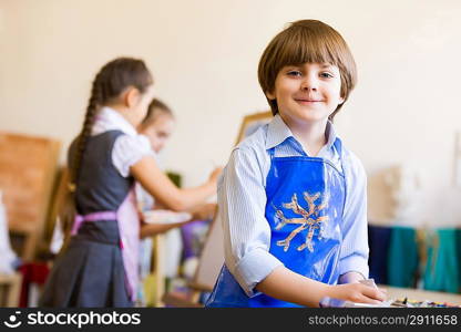 Cute boy painting