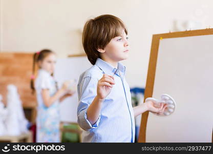 Cute boy painting