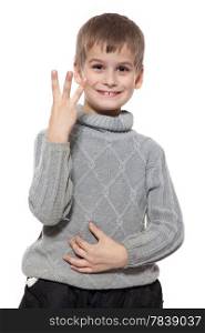 Cute boy smilling and showing three finger isolated on a white background