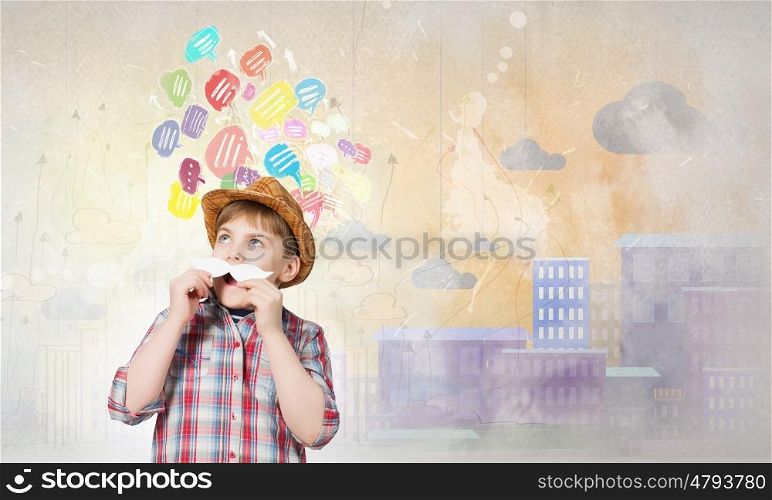 Cute boy wearing shirt hat and mustache. Kid having fun