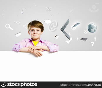 Cute boy with banner. Image of little cute with blank banner against color background