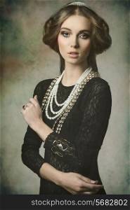 cute brunette girl posing in fantasy portrait wearing like a antique aristocratic lady with precious brilliant crown, vintage hair-style and brilliant jewellery