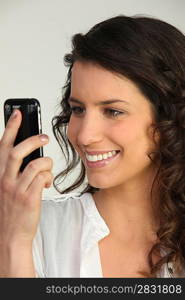 cute brunette happy to receive sms