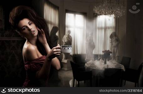 Cute brunette with cup of coffee