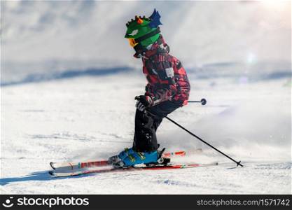 Cute Child Skiing Down the Slope