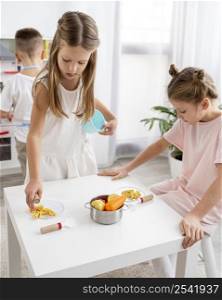 cute children playing with cooking game