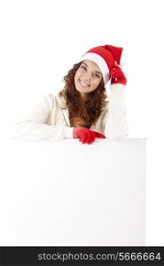 Cute christmas girl grabbing a placard over white