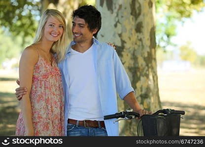 cute couple in park with bike