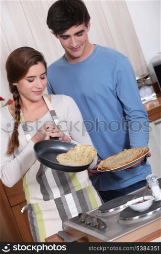 cute couple making crepes