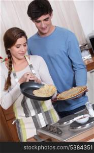cute couple making crepes